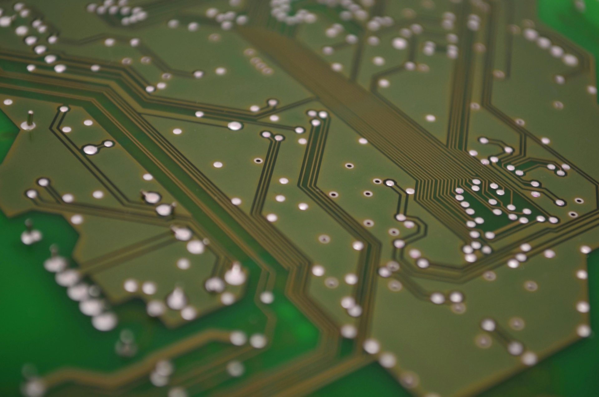 Detailed view of a printed circuit board showcasing intricate chip connections and pathways.